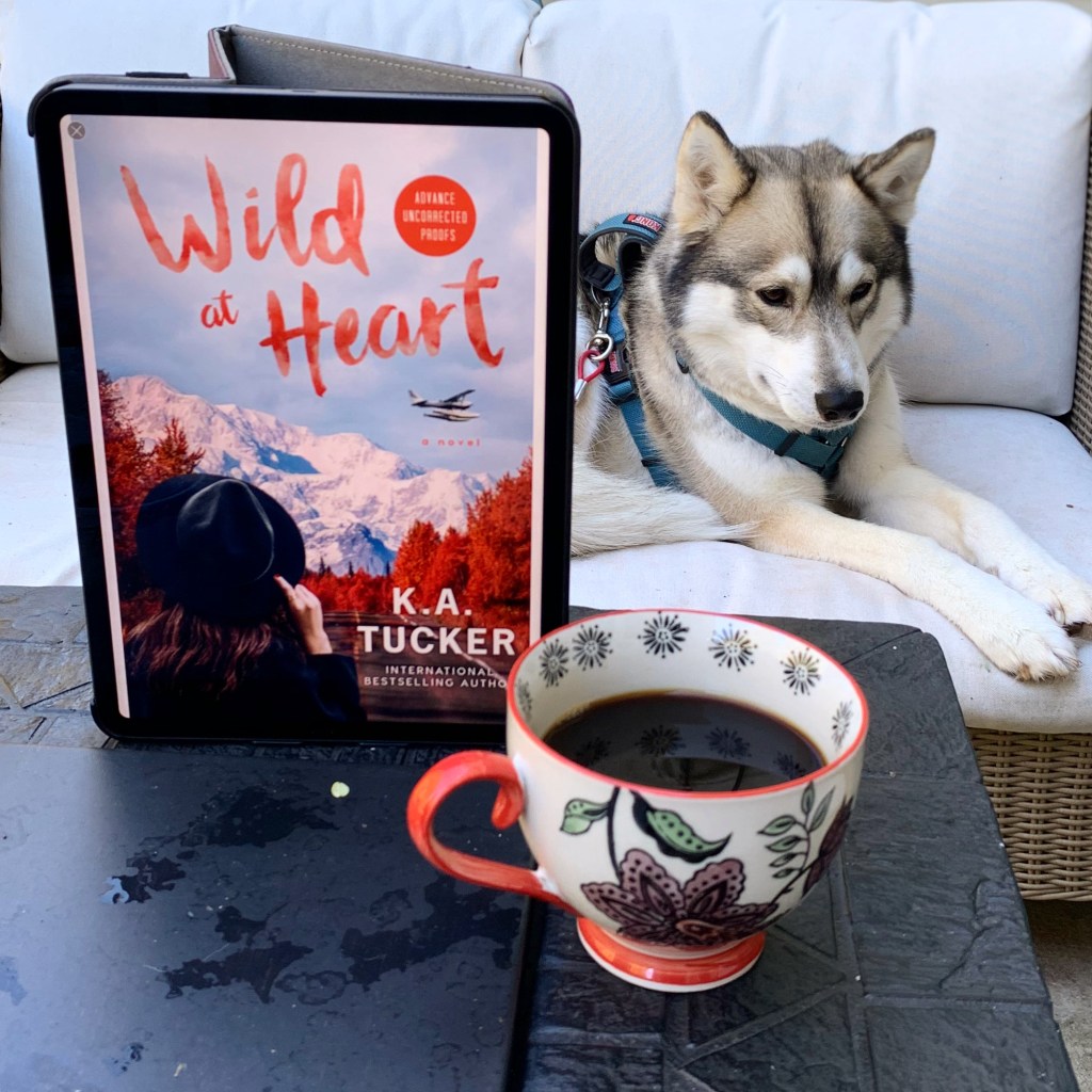 Photo of Wild At Heart ebook on iPad, husky, and a cup of coffee