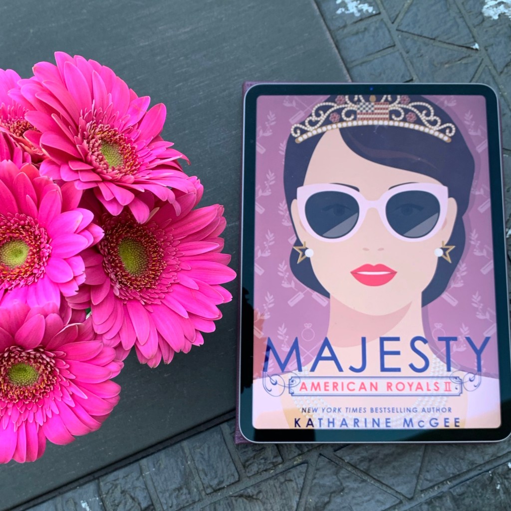 American Royals II: Majesty by Katharine McGee ebook on iPad with pink flowers