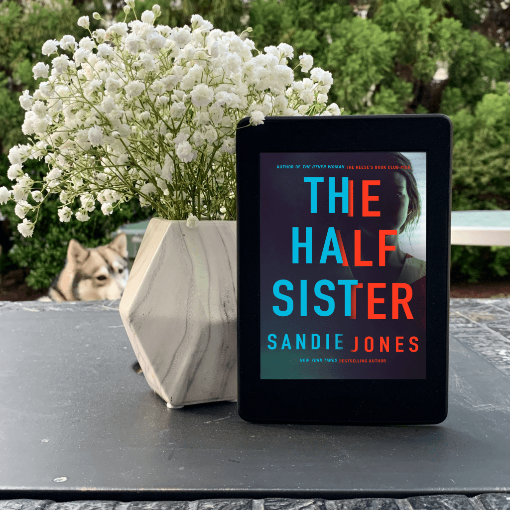 The Half Sister on Kindle with flowers and husky
