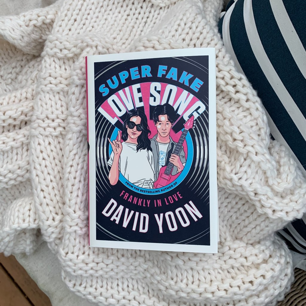 Super Fake Love Song by David Yoon hardcover on blanket